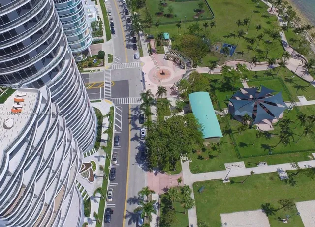 a kitchen with stainless steel appliances a refrigerator and a stove top oven