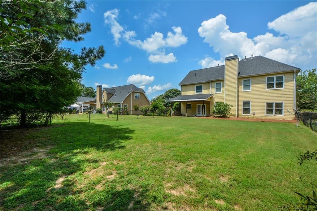 3420 Bulloch Lake Road Loganville, GA 30052 - Photo 52 of 57 a view of a house with a big yard