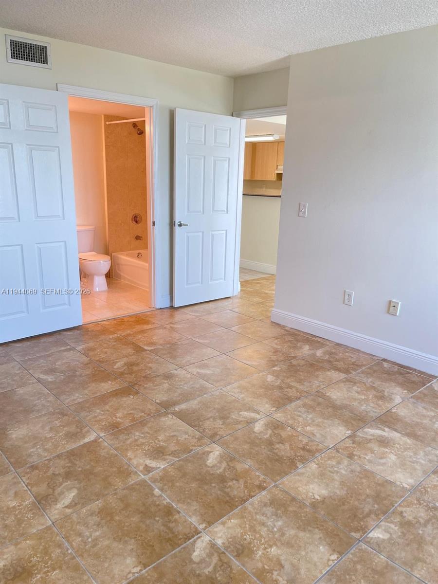 3000 Coral Way, Unit 1101 Miami, FL 33145 - Photo 3 of 16 an empty room with closet area