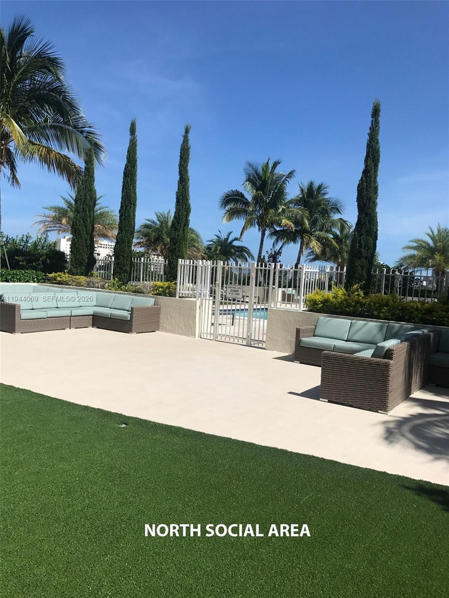 3000 Coral Way, Unit 1101 Miami, FL 33145 - Photo 9 of 16 a view of a swimming pool with a table and chairs