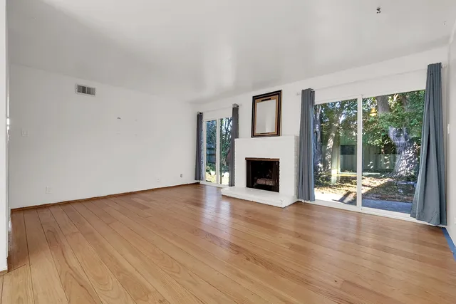 a kitchen with granite countertop a stove and a sink