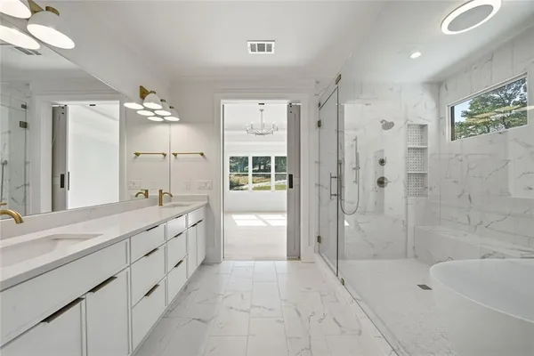 a view of a room with wooden floor and white walls