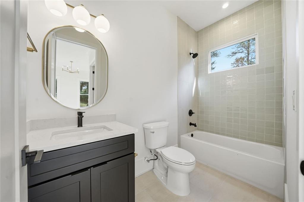 420 Stock Gap Road Southwest Monroe, GA 30656 - Photo 28 of 50 a bathroom with a toilet sink and a mirror