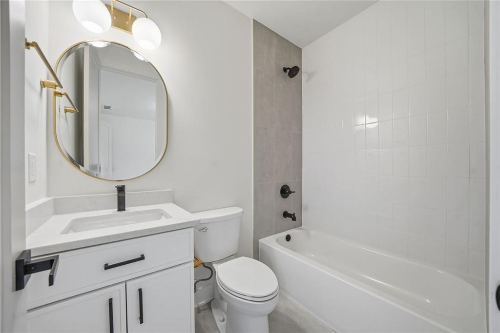 420 Stock Gap Road Southwest Monroe, GA 30656 - Photo 41 of 50 a bathroom with a sink toilet and a mirror