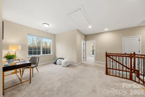a view of a livingroom with furniture and windows
