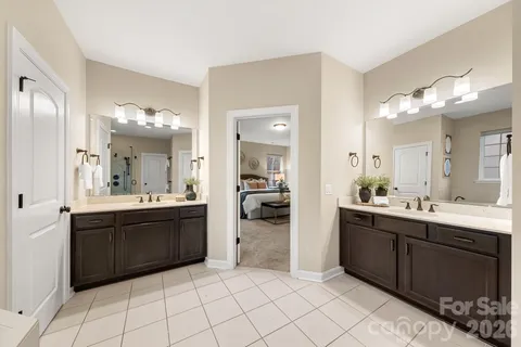 a bathroom with a sink vanity and a mirror