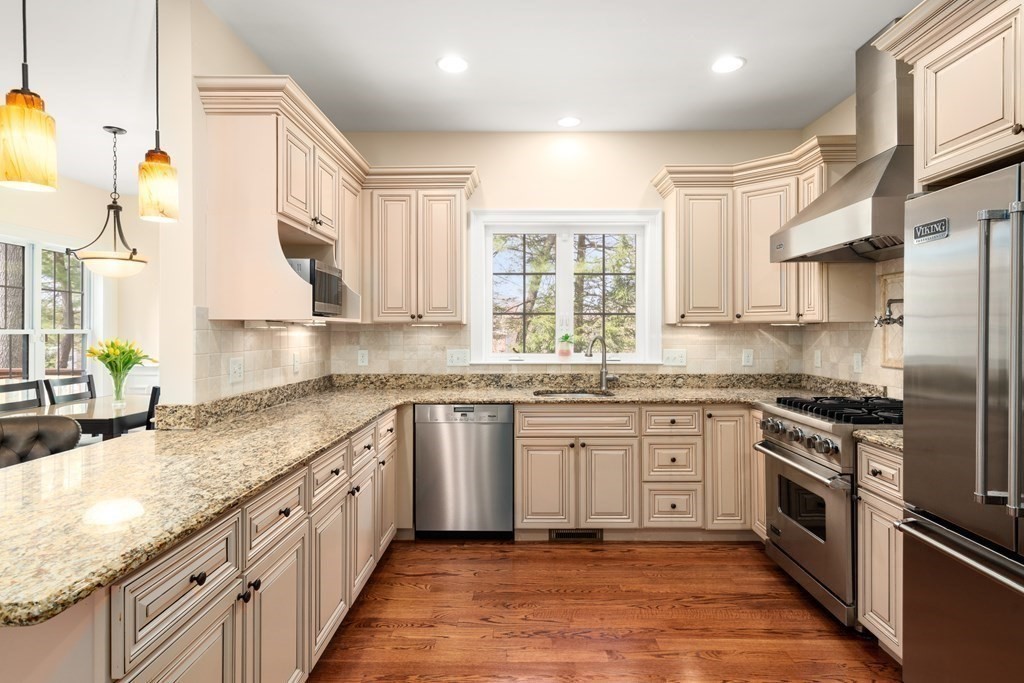 11 Shadow Lane Wellesley, MA 02482 - Photo 12 of 37 a kitchen with stainless steel appliances granite countertop a sink stove and refrigerator