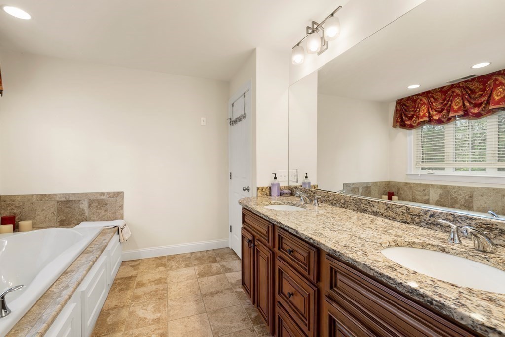 11 Shadow Lane Wellesley, MA 02482 - Photo 20 of 37 a bathroom with a granite countertop sink and a mirror