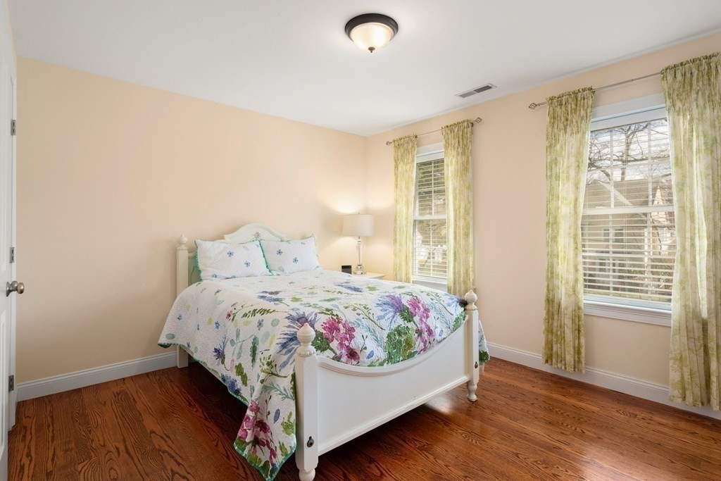 11 Shadow Lane Wellesley, MA 02482 - Photo 21 of 37 a bed sitting in a bedroom next to a window
