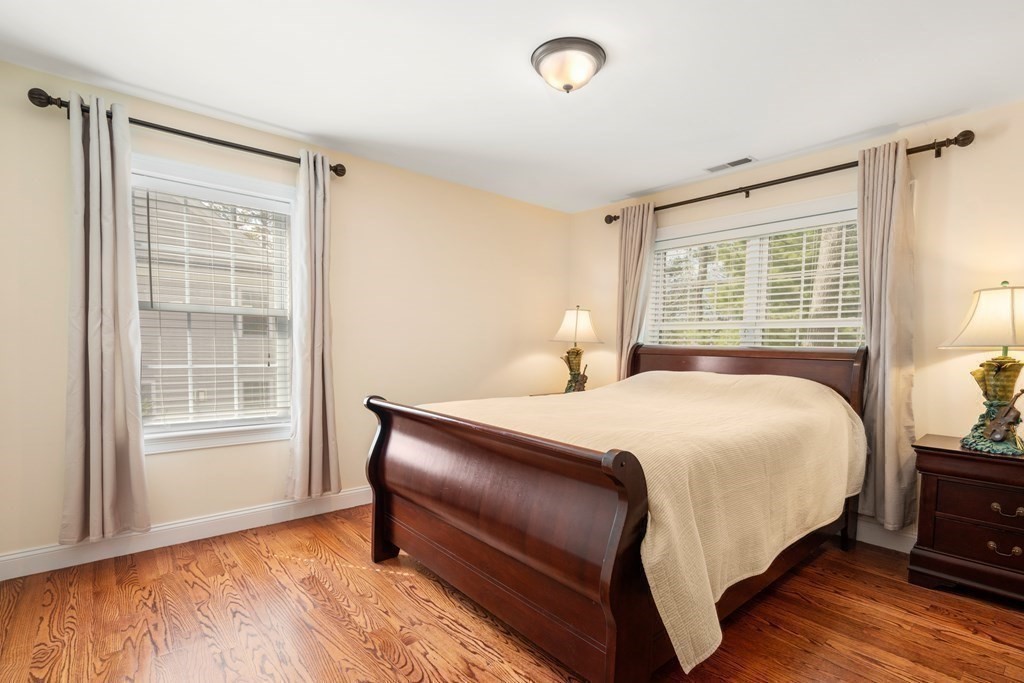 11 Shadow Lane Wellesley, MA 02482 - Photo 23 of 37 a bedroom with a bed and wooden floor