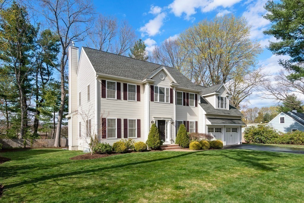 11 Shadow Lane Wellesley, MA 02482 - Photo 36 of 37 a front view of a house with a garden