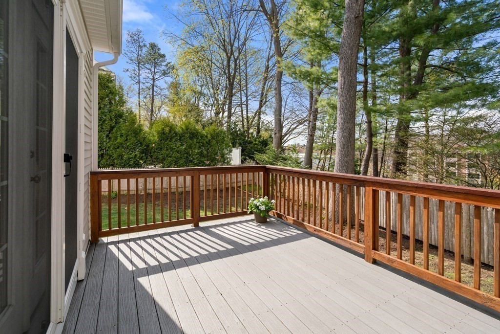 11 Shadow Lane Wellesley, MA 02482 - Photo 8 of 37 a balcony with wooden floor and fence