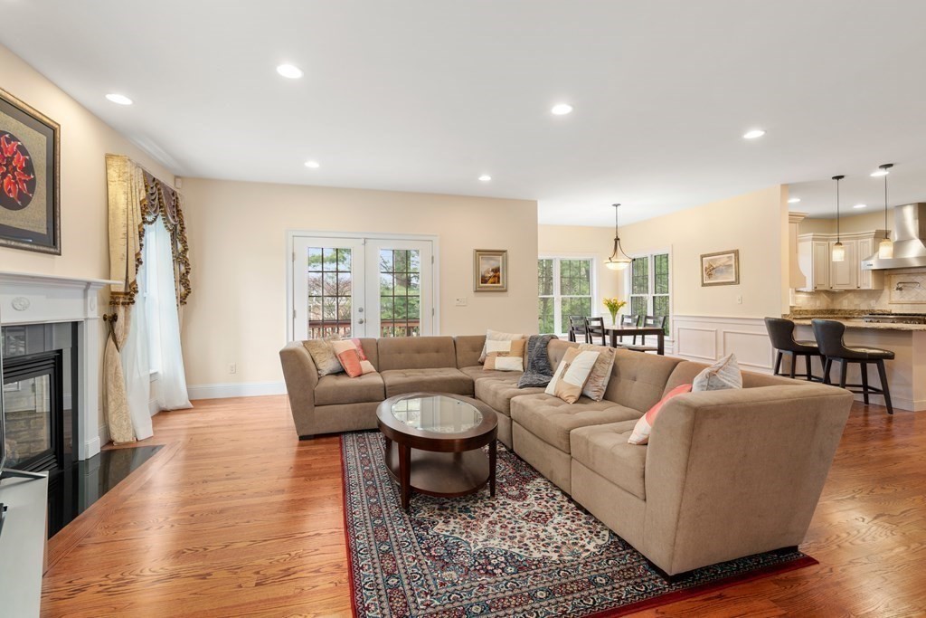 11 Shadow Lane Wellesley, MA 02482 - Photo 9 of 37 a living room with fireplace furniture and a wooden floor