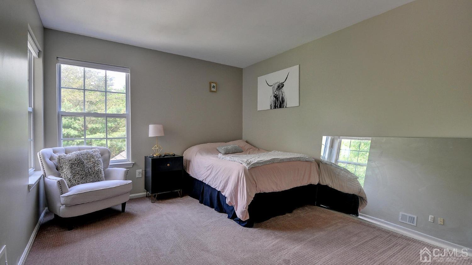 344 Freehold Road Jackson, NJ 08527 - Photo 19 of 37 a bedroom with a bed and a couch