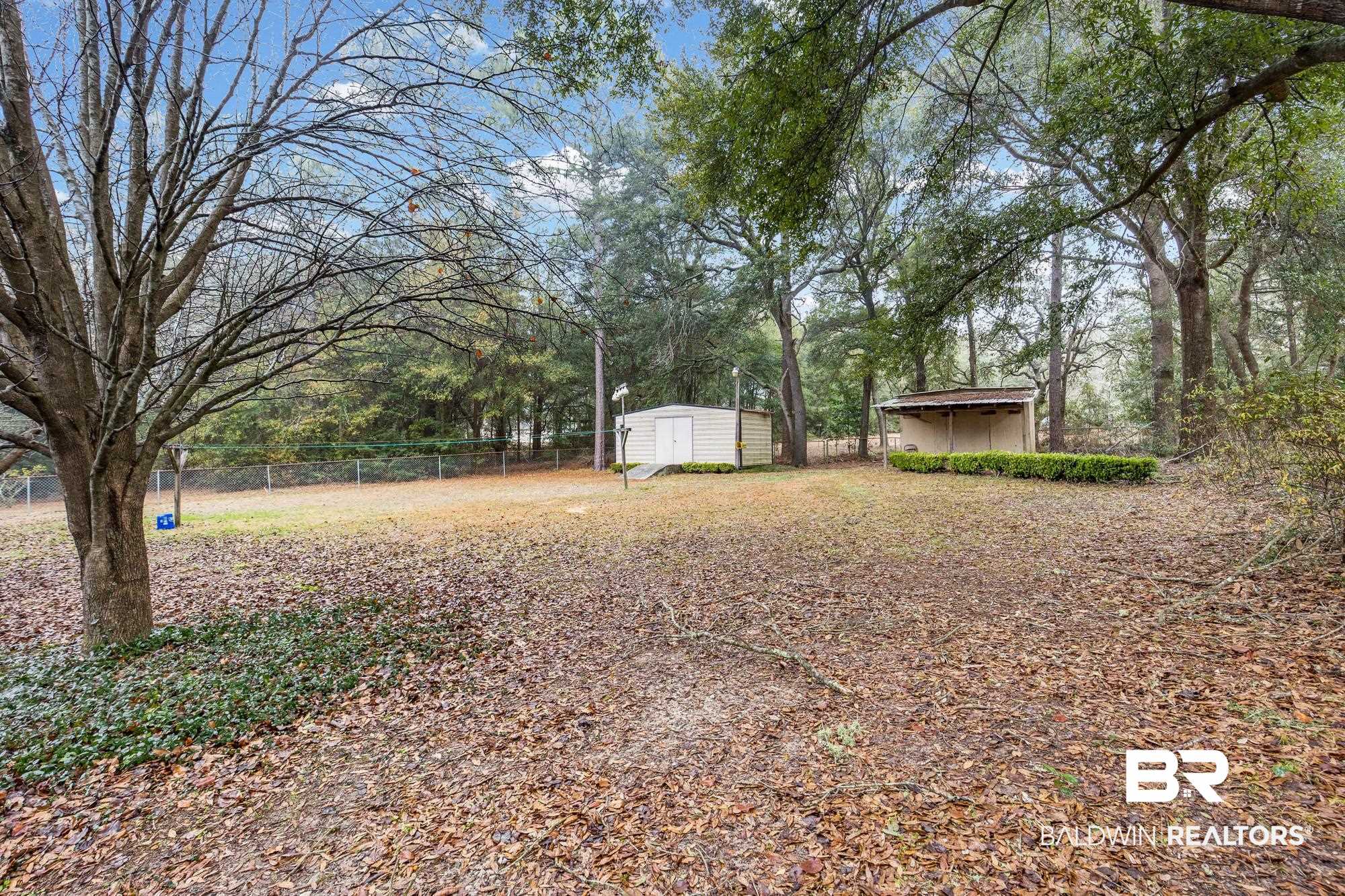 7345 Spaceview Drive Saraland, AL 36571 - Photo 21 of 22 View of yard with a shed