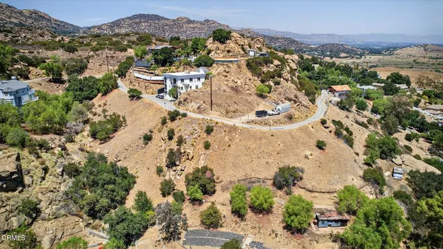 an aerial view of residential house with an outdoor space