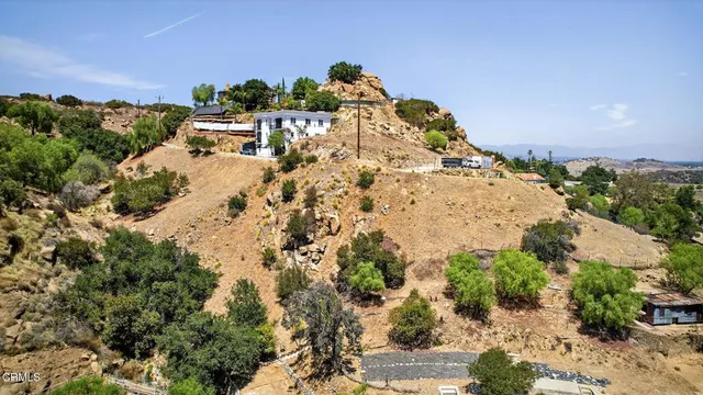 an aerial view of residential house with an outdoor space