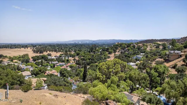 a view of a road with a building in the background