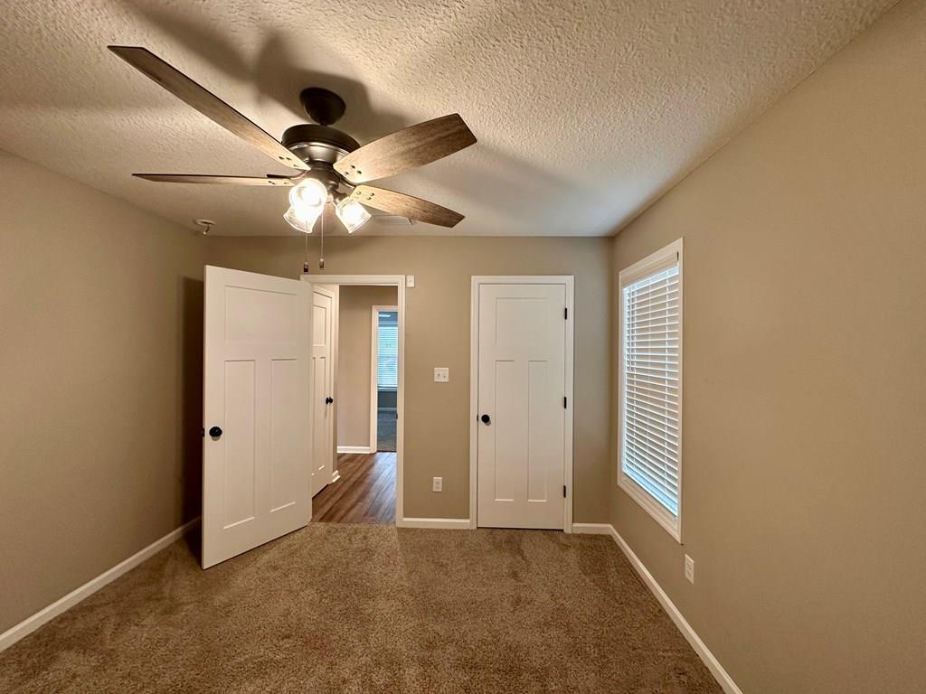 4603 Brees Way Valdosta, GA 31601 - Photo 15 of 31 wooden floor in an empty room with a window