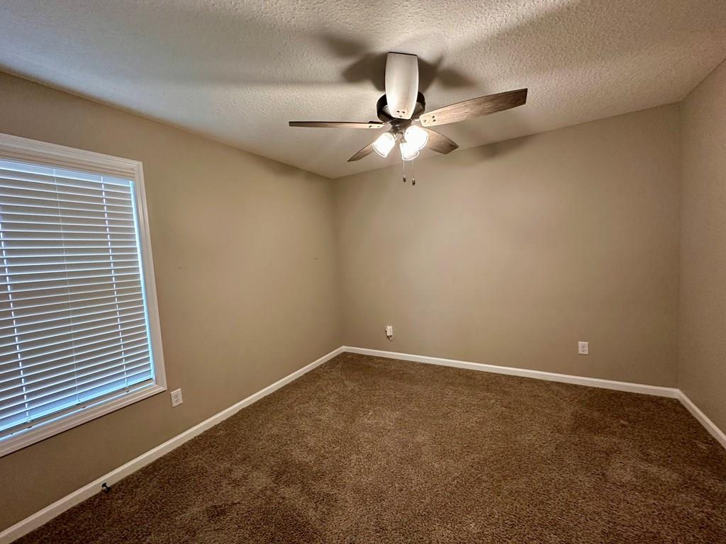 4603 Brees Way Valdosta, GA 31601 - Photo 21 of 31 an empty room with a window and a fan