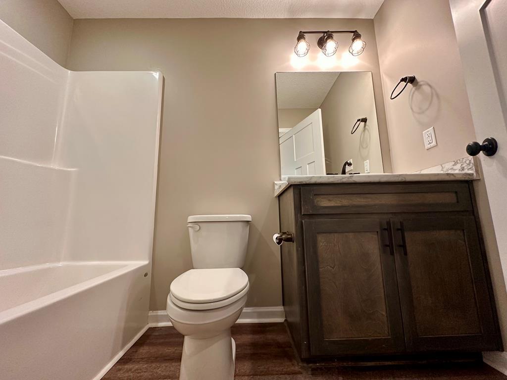 4603 Brees Way Valdosta, GA 31601 - Photo 23 of 31 a bathroom with a toilet a sink and bathtub