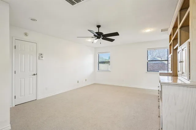 a very nice looking room with a ceiling fan