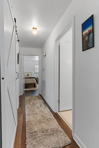 a view of walk in closet with clothes