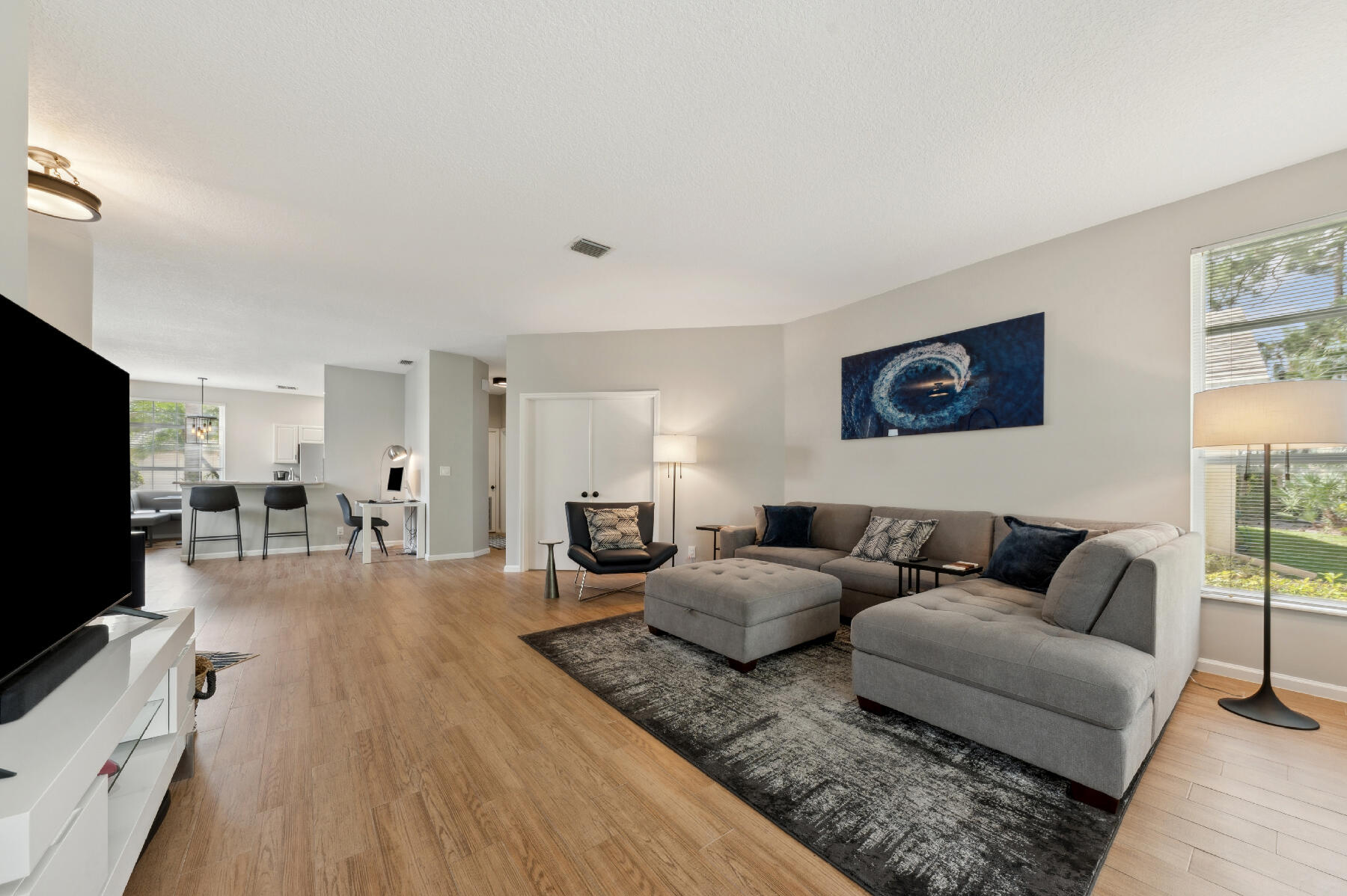 175 Harbor Lake Circle Greenacres, FL 33413 - Photo 33 of 33 a living room with furniture and a flat screen tv