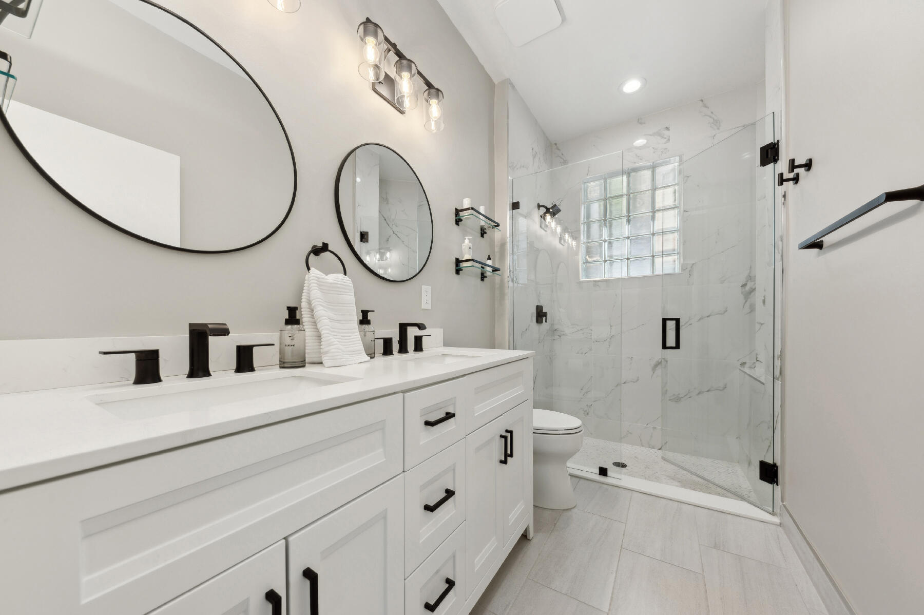 175 Harbor Lake Circle Greenacres, FL 33413 - Photo 11 of 33 a bathroom with a double vanity sink mirror and a toilet