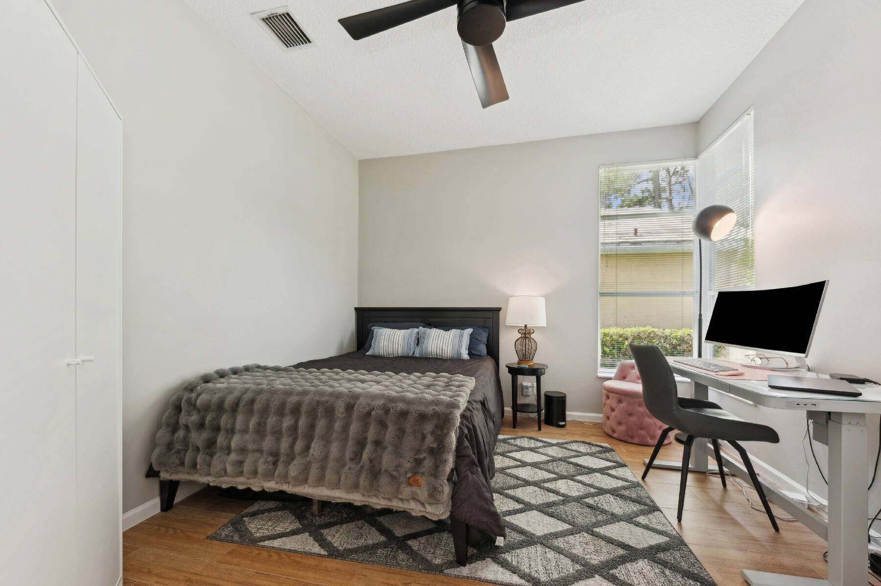 175 Harbor Lake Circle Greenacres, FL 33413 - Photo 17 of 33 a bedroom with a bed and a desk