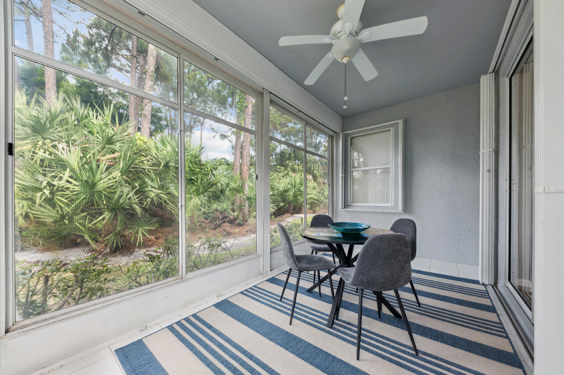 175 Harbor Lake Circle Greenacres, FL 33413 - Photo 19 of 33 a dining room with furniture wooden floor and a rug