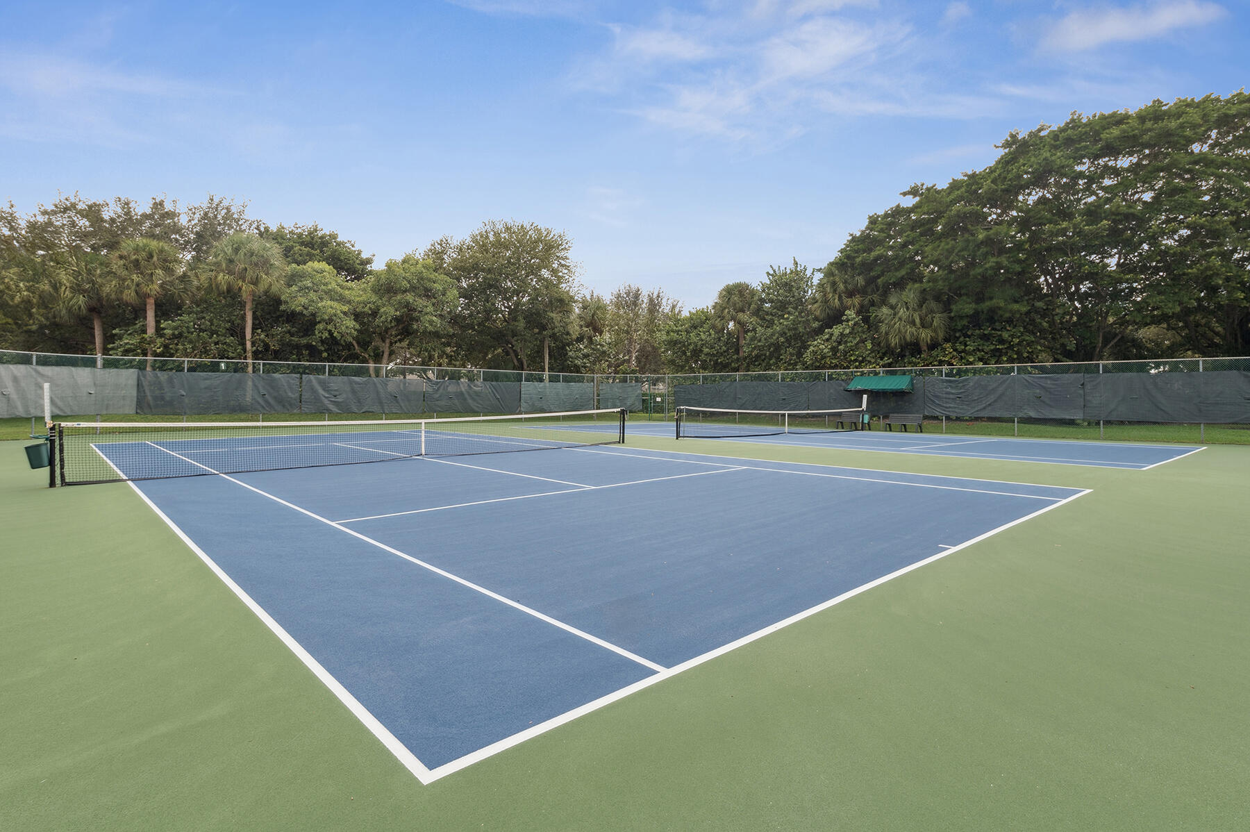 175 Harbor Lake Circle Greenacres, FL 33413 - Photo 29 of 33 a tennis court that has tennis net