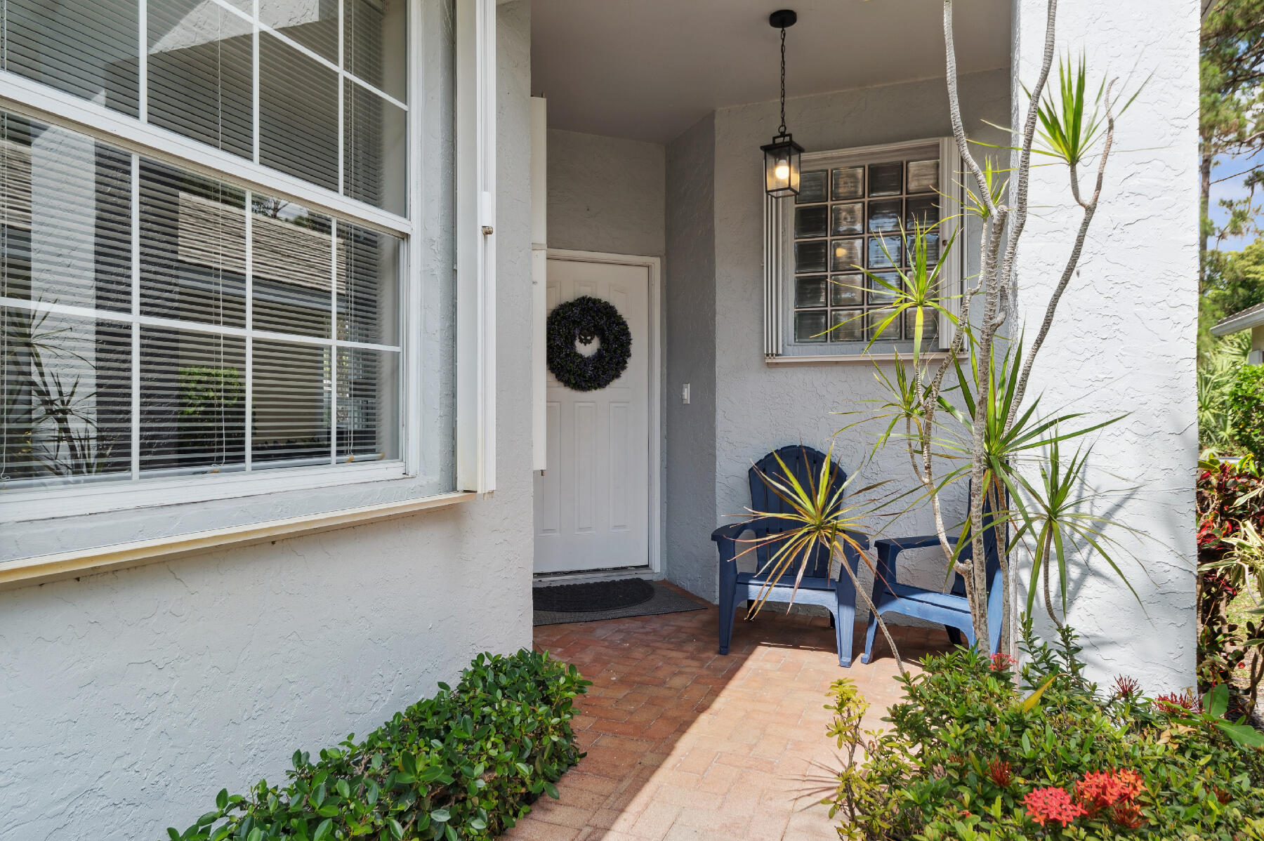 175 Harbor Lake Circle Greenacres, FL 33413 - Photo 2 of 33 a house view with a garden space