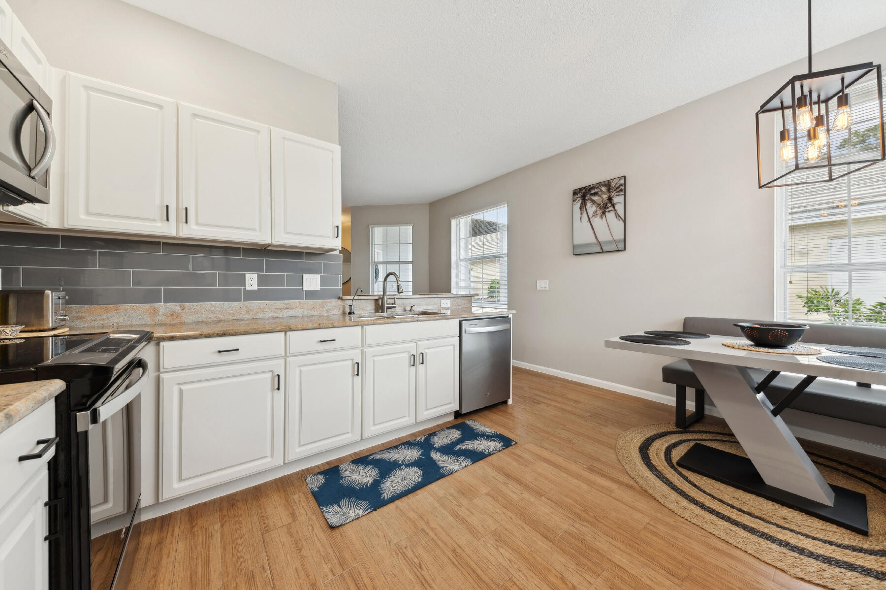 175 Harbor Lake Circle Greenacres, FL 33413 - Photo 5 of 33 a view of a kitchen with workspace and wooden floor