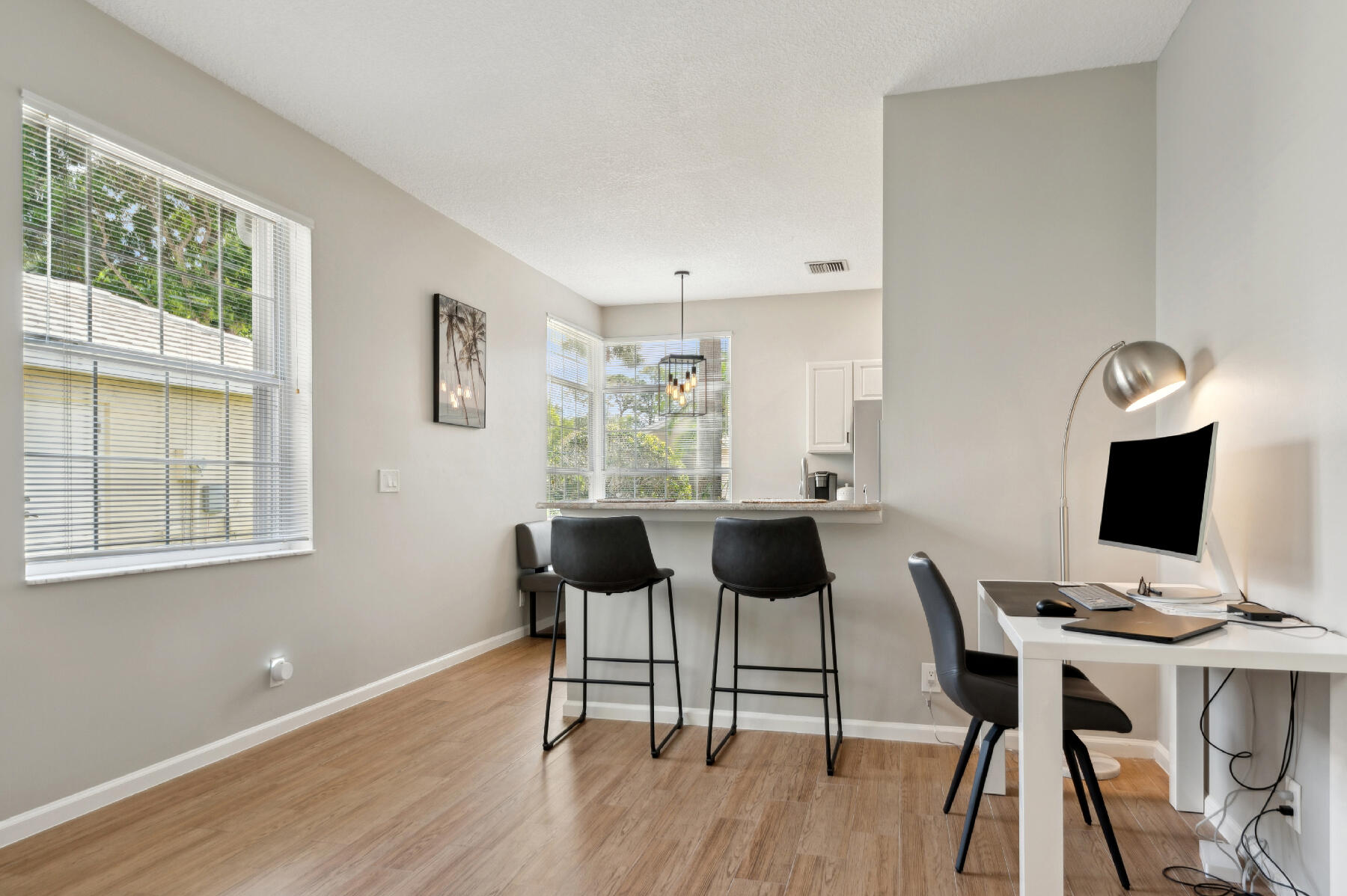 175 Harbor Lake Circle Greenacres, FL 33413 - Photo 7 of 33 a view of a workspace with furniture and a window