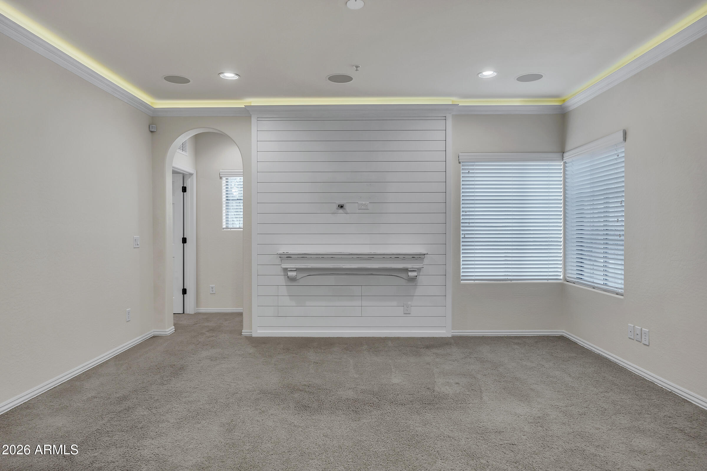 3935 East Rough Rider Road, Unit 1250 Phoenix, AZ 85050 - Photo 13 of 29 an empty room with windows and closet