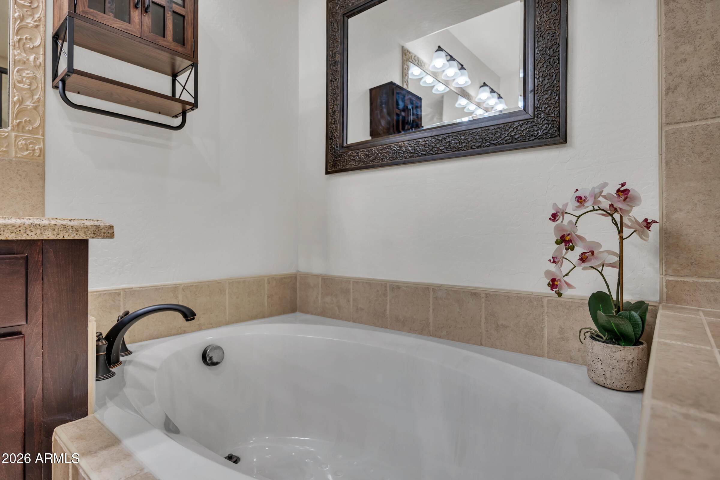 3935 East Rough Rider Road, Unit 1250 Phoenix, AZ 85050 - Photo 22 of 29 a bathroom with a tub