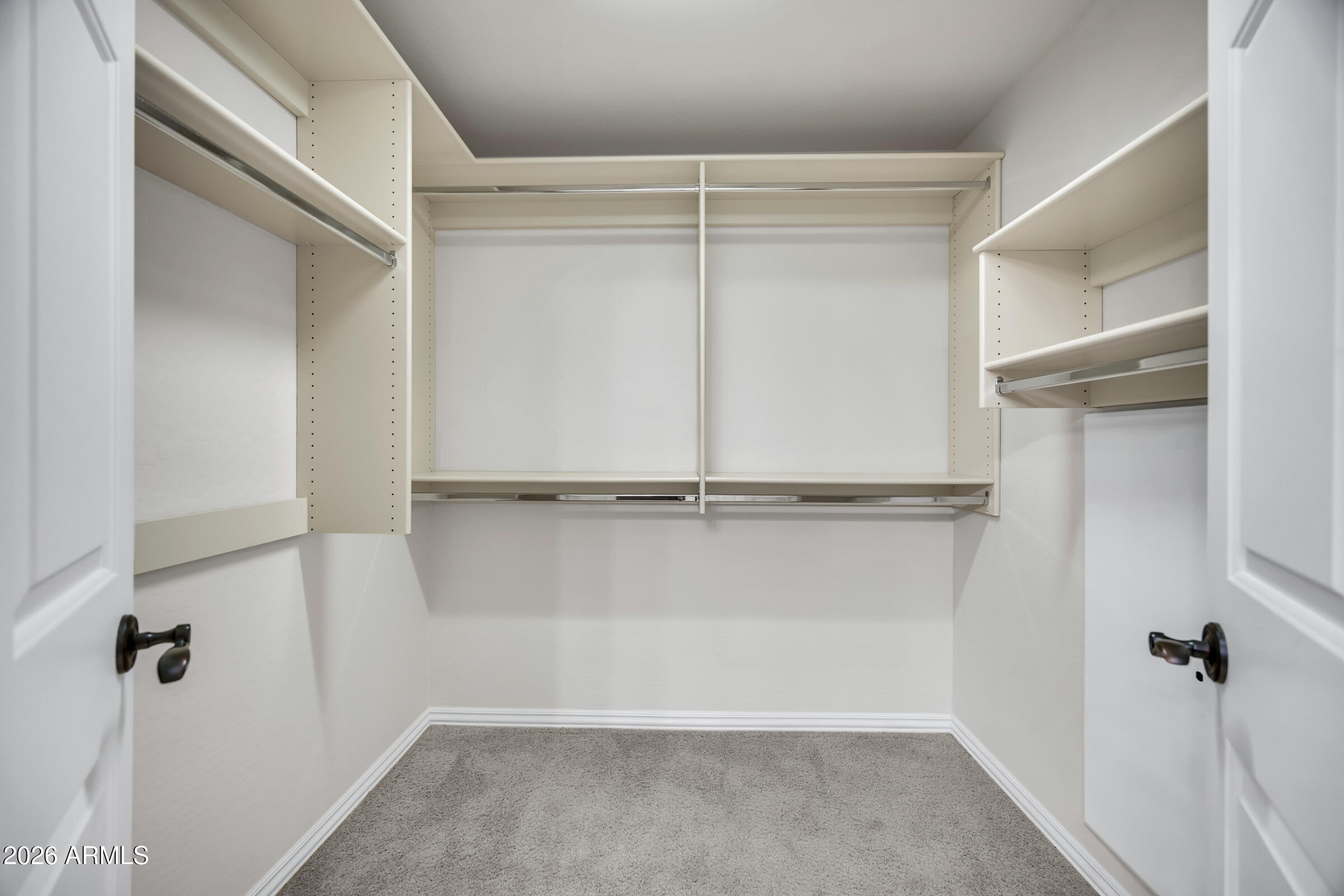 3935 East Rough Rider Road, Unit 1250 Phoenix, AZ 85050 - Photo 23 of 29 a view of an empty walk in closet