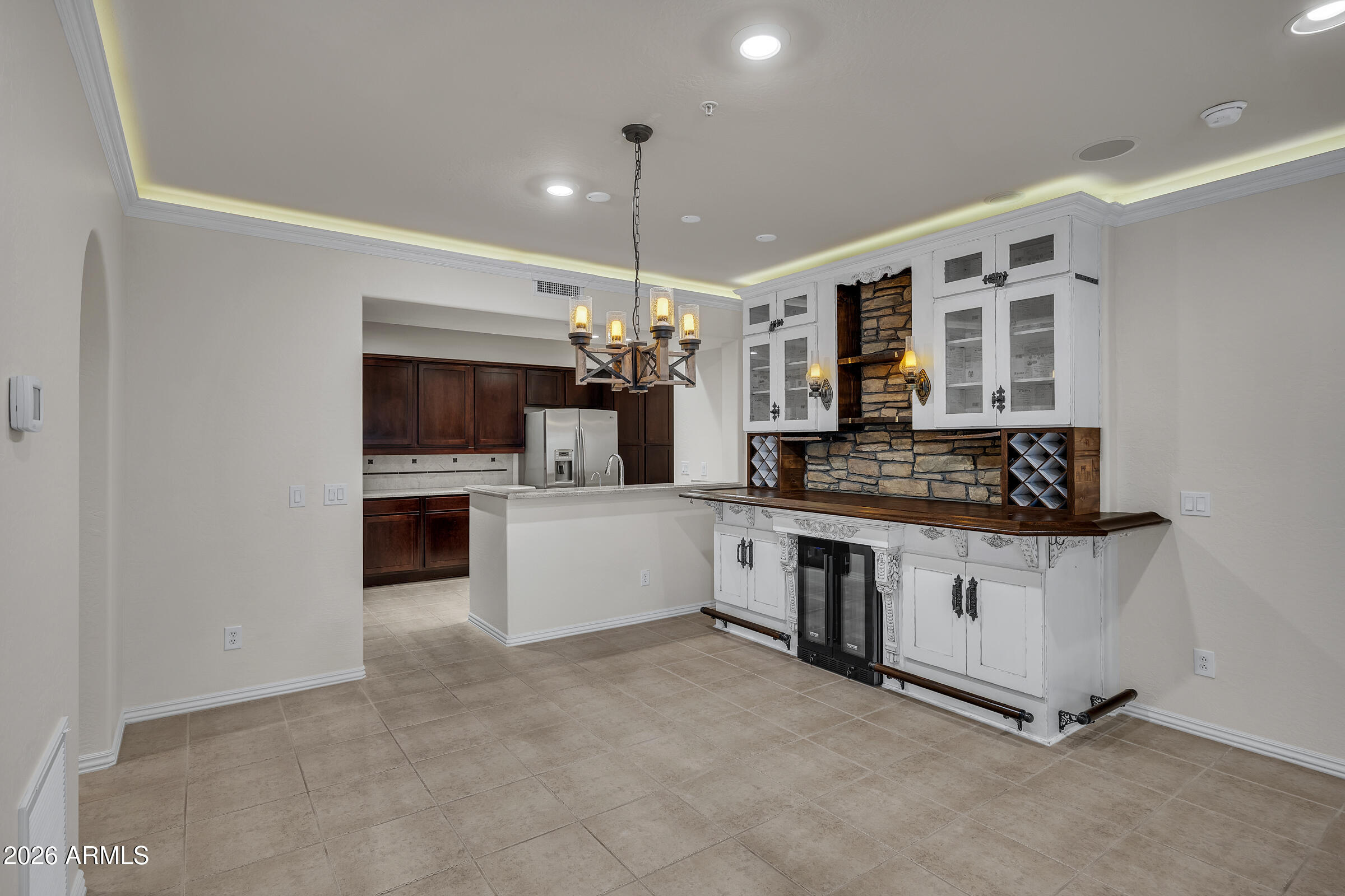3935 East Rough Rider Road, Unit 1250 Phoenix, AZ 85050 - Photo 6 of 29 a kitchen with stainless steel appliances granite countertop a stove and a sink