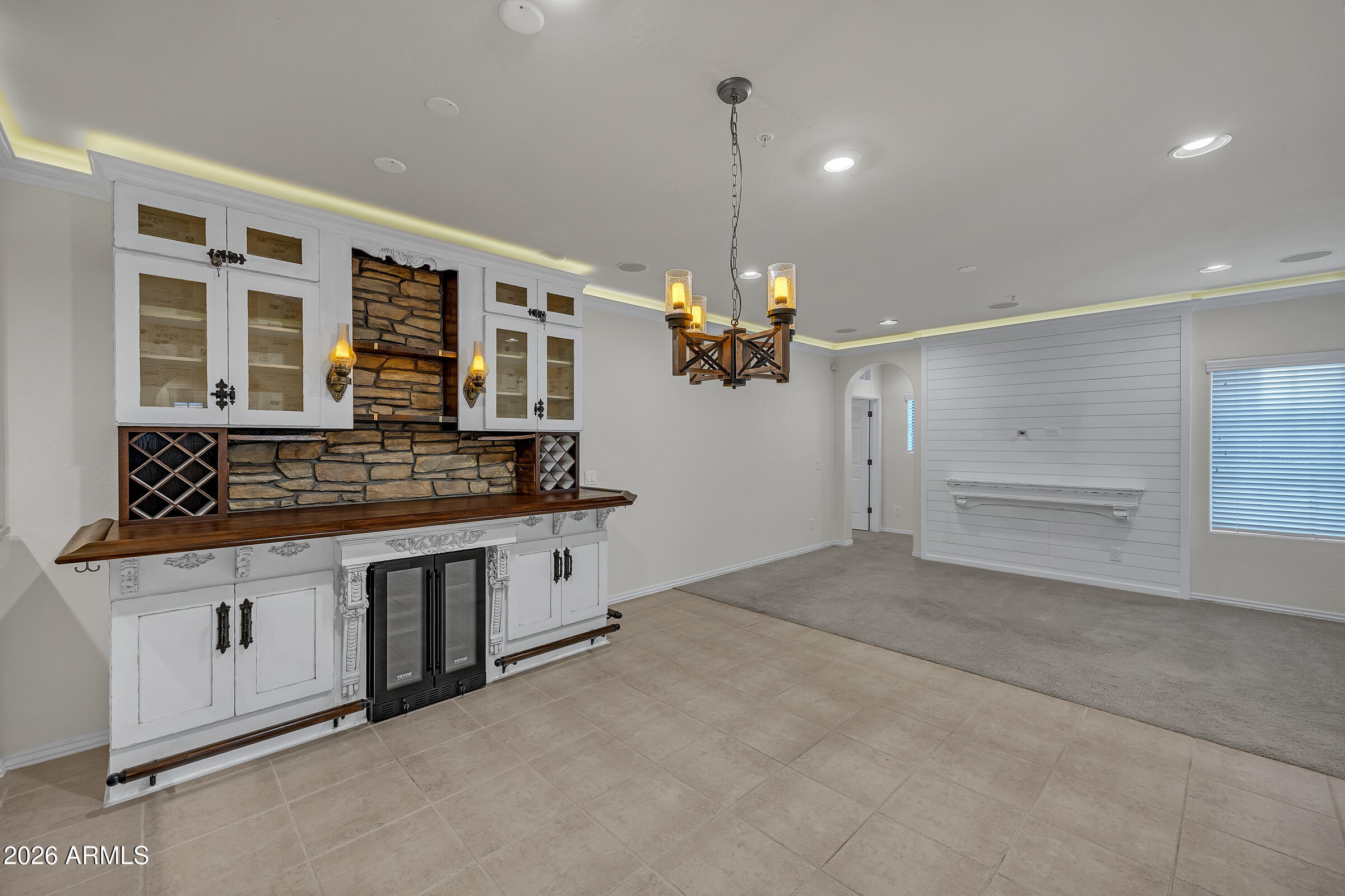 3935 East Rough Rider Road, Unit 1250 Phoenix, AZ 85050 - Photo 8 of 29 a view of kitchen with granite countertop stove top oven and cabinets