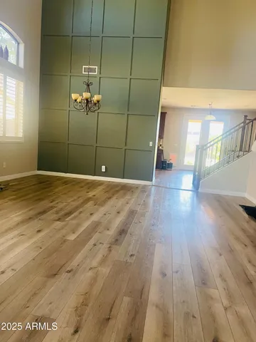 a view of a room with wooden floor