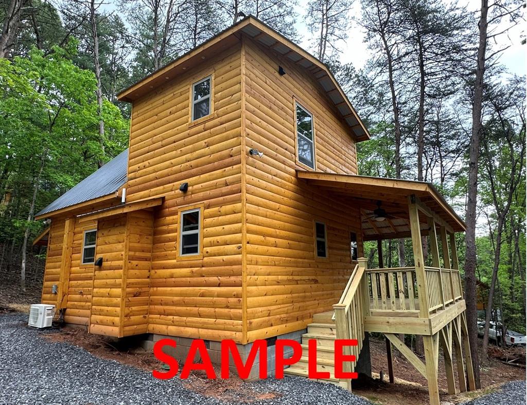 a front view of house with deck and outdoor seating