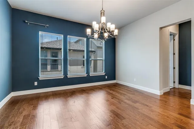 a kitchen with granite countertop a sink stove and cabinets