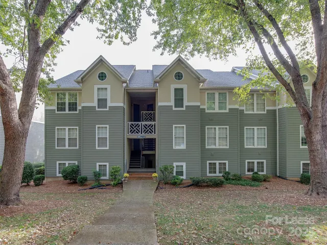 a front view of a house with yard