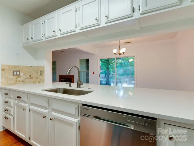 a kitchen with a sink and cabinets