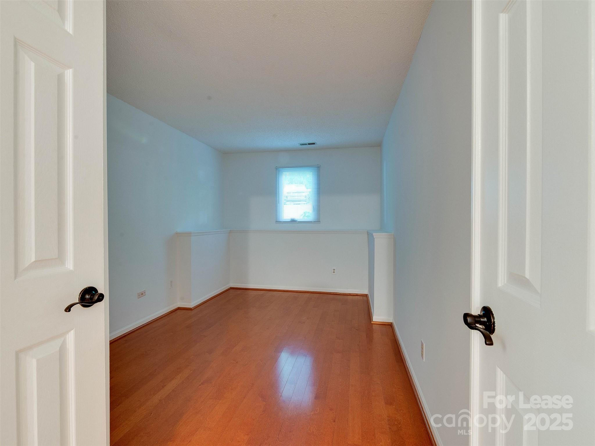 19827 Henderson Road, Unit B Cornelius, NC 28031 - Photo 19 of 48 a view of a livingroom with a staircase