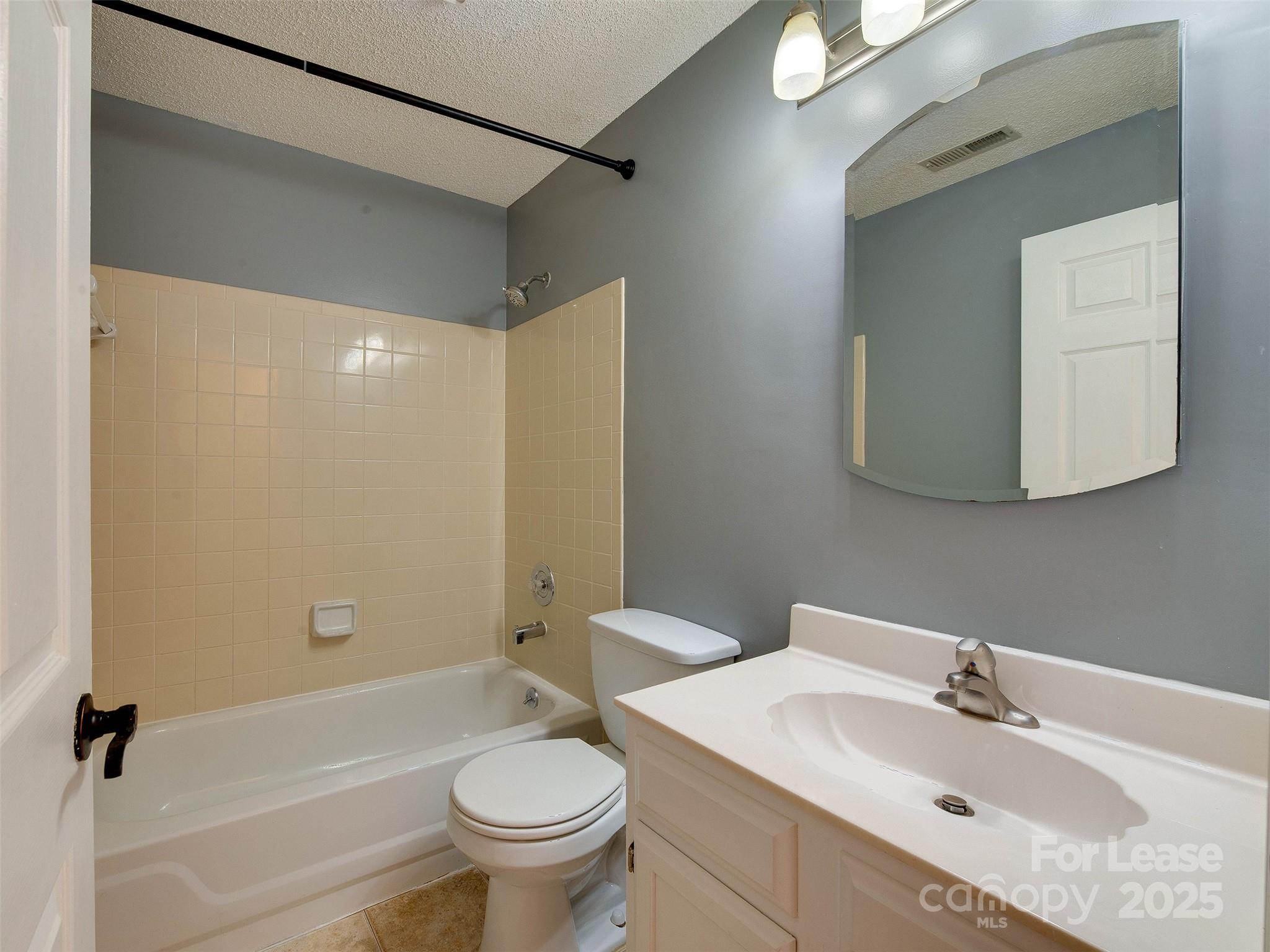 19827 Henderson Road, Unit B Cornelius, NC 28031 - Photo 21 of 48 a bathroom with a sink toilet and shower