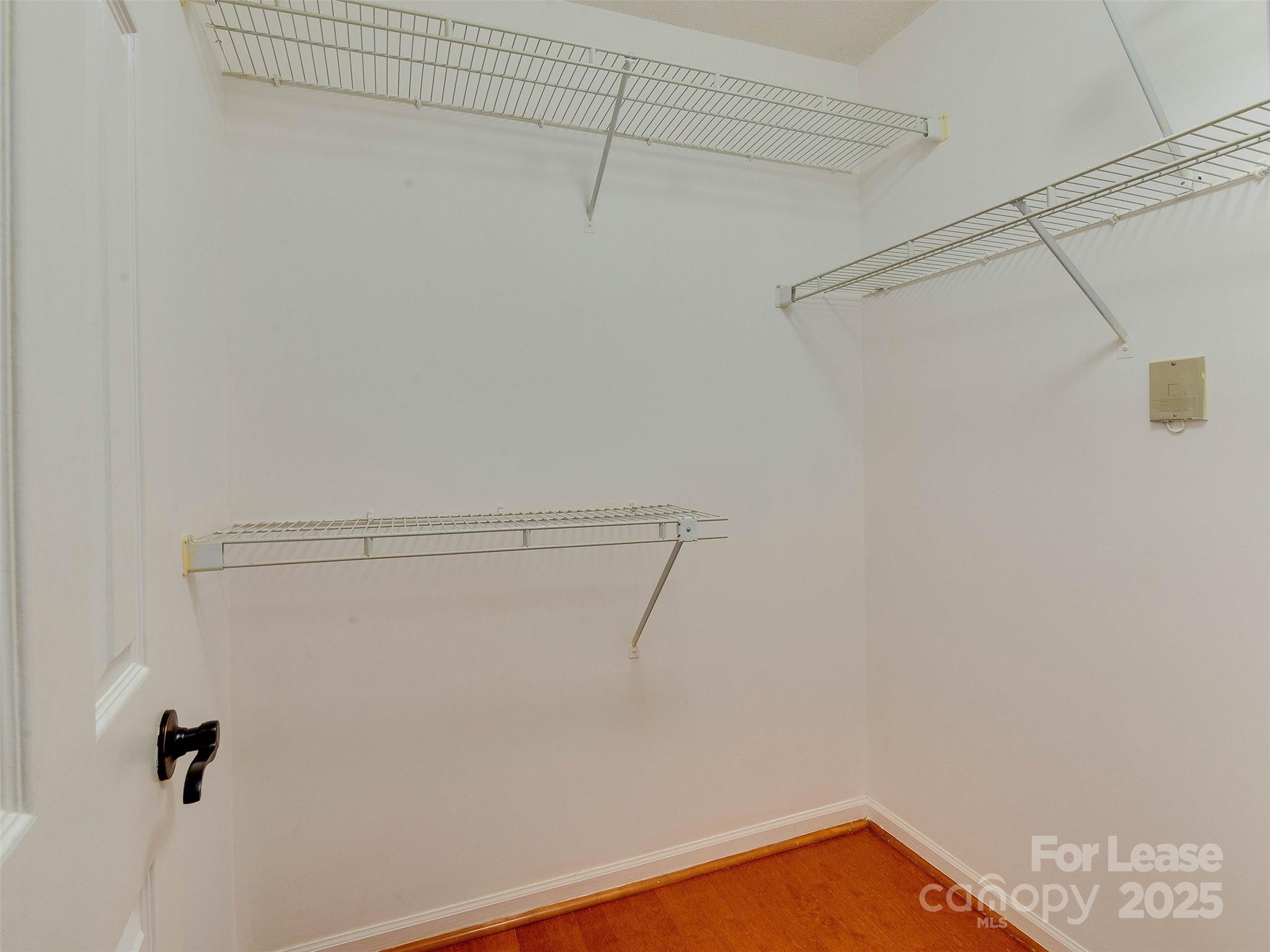 19827 Henderson Road, Unit B Cornelius, NC 28031 - Photo 24 of 48 a view of a room with racks on the wall