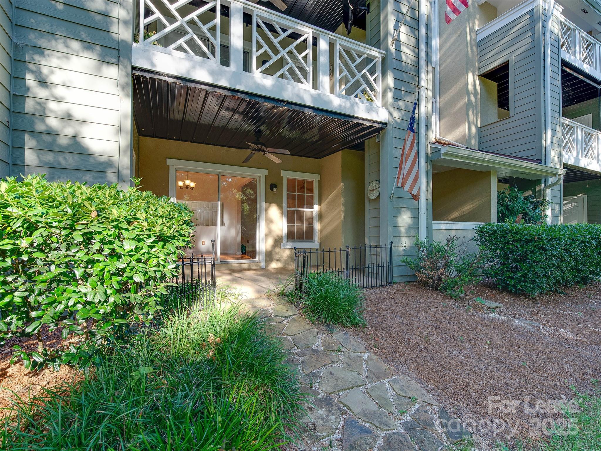 19827 Henderson Road, Unit B Cornelius, NC 28031 - Photo 29 of 48 a view of a building with potted plants