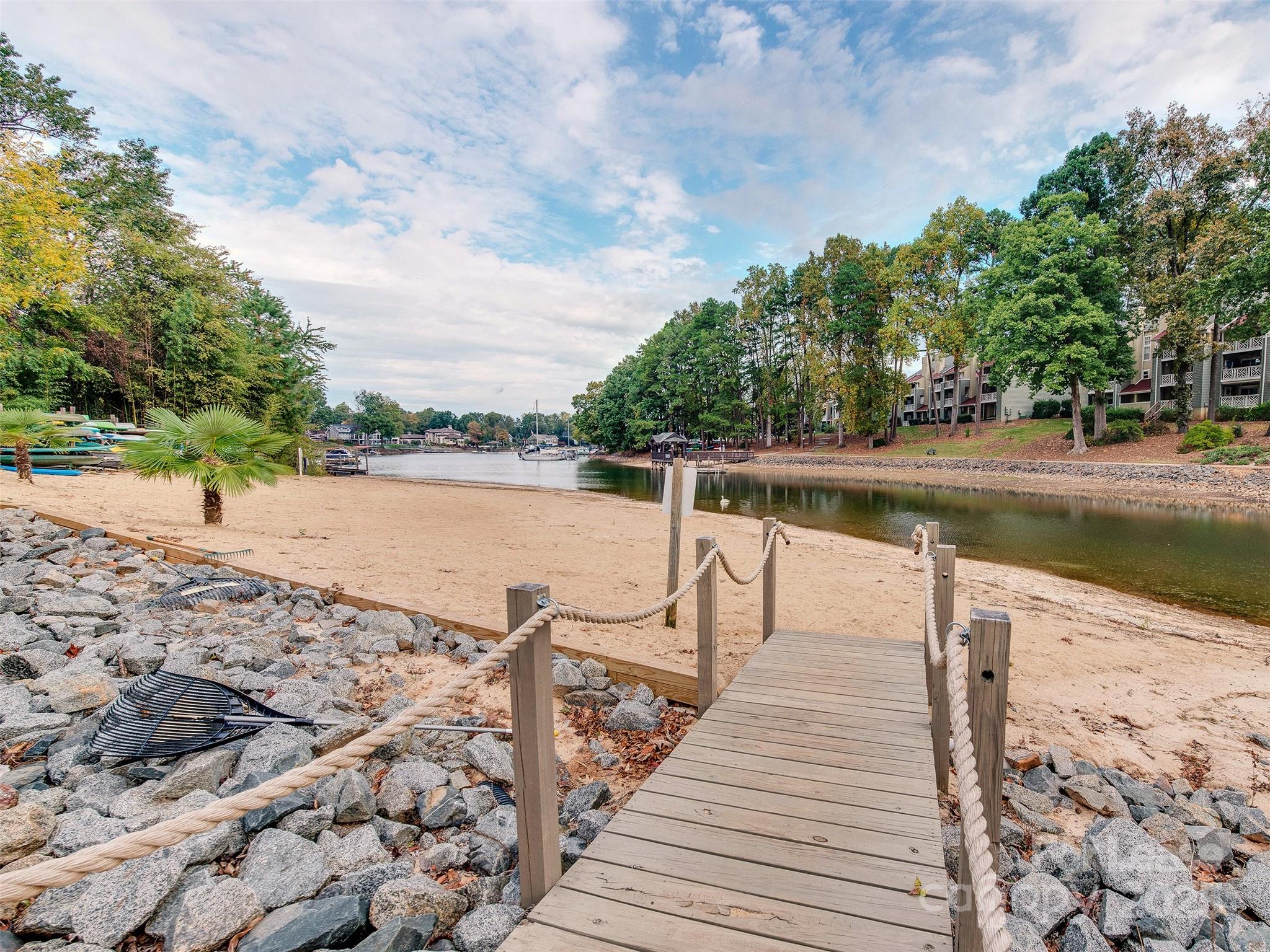 19827 Henderson Road, Unit B Cornelius, NC 28031 - Photo 40 of 48 a view of a swimming pool with a lake view